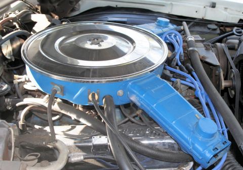 1976 Ford Ranchero - Close-up of an engine bay, focusing on the air cleaner and associated engine components.