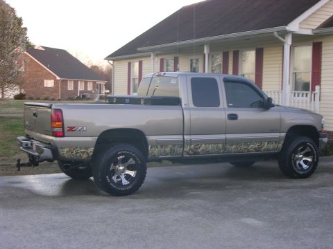 2000 Chevrolet Silverado 1500 - This 2000 Chevrolet Silverado 1500 Z71 pickup truck is seen from the side, camouflage graphics.