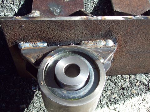 1989 Ford F-150 - This image shows a close-up of a metal bracket with welds and a bushing, not a vehicle.