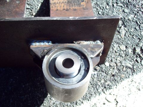 1989 Ford F-150 - A close-up view of a fabricated suspension part, showing welded metal construction.