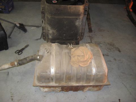 1991 Ford Bronco - Removed fuel tank and its mounting bracket from a vehicle.