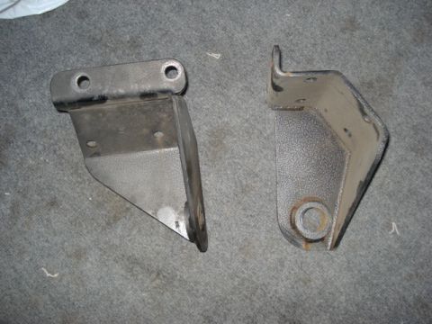 1978 Ford Bronco - Two metal brackets are shown against a carpeted background. The image includes a watermark for SuperMotors.net.