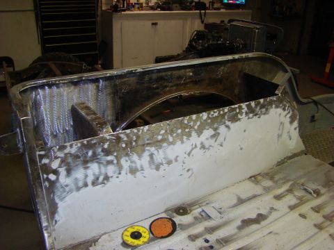 1948 Jeep Wrangler - This image shows a section of a vehicle's body undergoing repair, with visible welding and filler work in-progress bodywork.