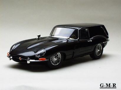 1993 Ford Bronco - Model of a black Jaguar E-Type shooting brake, seen from the front 3/4 angle.