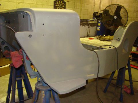 1948 Jeep Wrangler - This vehicle body, possibly undergoing restoration, is supported by jack stands in a workshop setting.