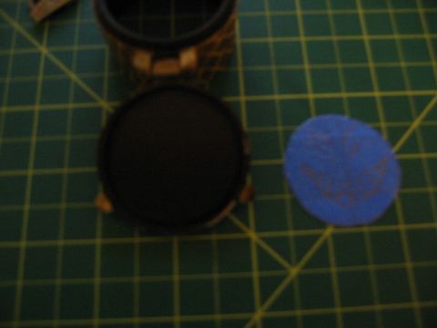 1996 Ford Bronco - A close-up shows a vehicle part on a cutting mat next to a blue sticker with red lettering.