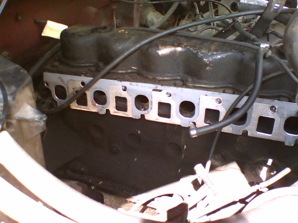 A picture of the intake and exhaust ports on the 300.  Despite the fact that it took five hours to remove the exhaust manifolds from the donor EFI 4.9 with a friend, it took me 20 minutes to remove both the intake and exhaust on my carbed 300.  

Admittedly, this is one great perk of the 300 versus a V8.  There is just so much room.