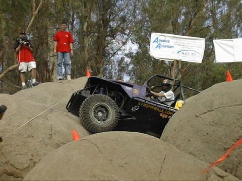 1997 Ford Ranger - Off-road buggy navigates a challenging rock crawling course during an event.