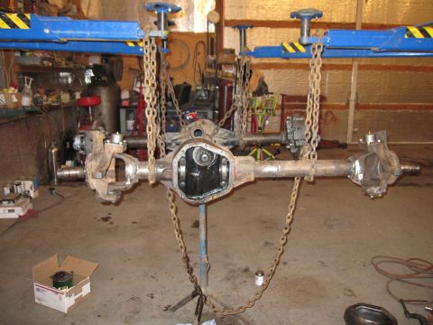 1992 Ford Bronco - A rear axle assembly is shown, likely from a vehicle, suspended for inspection or repair.