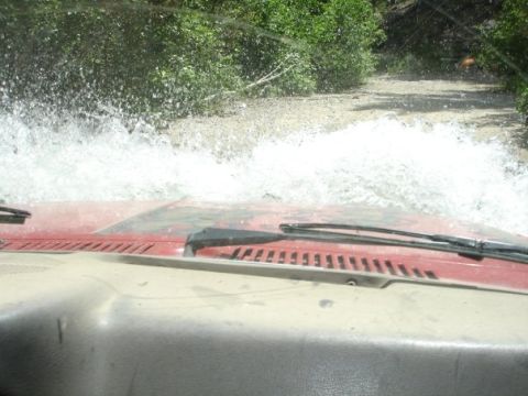 1981 Ford Bronco - Blasting through a river others were turning around from on the way to the trailhead.