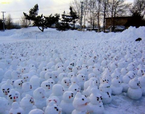 1991 Ford Crown Victoria - An expansive scene depicts a multitude of snowmen gathered in a snow-covered field.