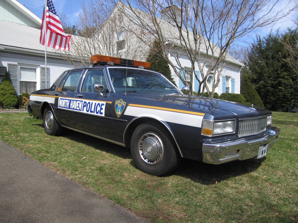 North Haven Police car with light bar and American flag