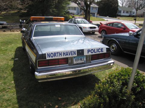1991 Ford LTD Crown Victoria - This police car, marked 'NORTH HAVEN POLICE', is parked in a residential area.