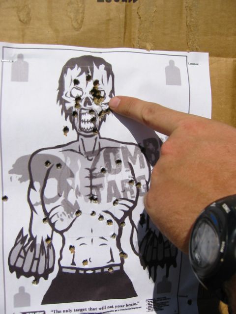 1996 Ford Bronco - Target practice with a zombie target, showing bullet holes and a finger pointing to the head.