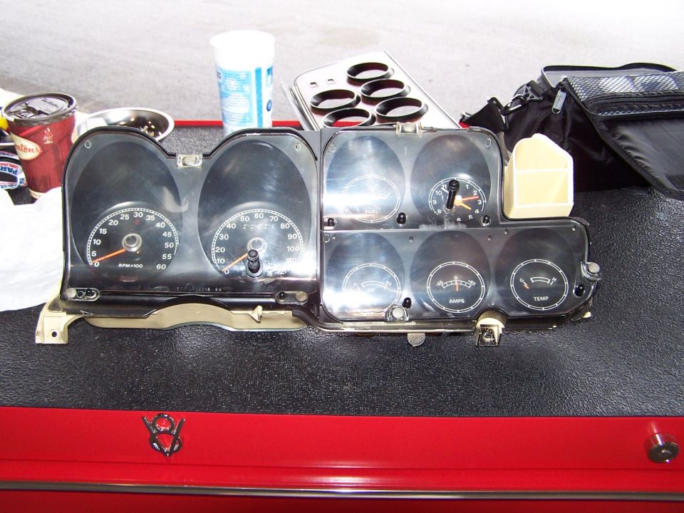 instrument cluster being dissassembled for cleaning