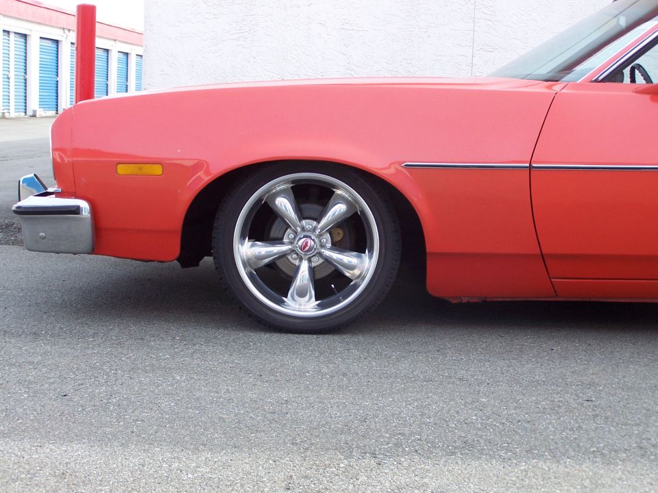I cut 1.5 coils off the front coil springs to get the car down 2" in the front. This was a bit too low, ride suffered and it dragged on everything. Now I've gone back to new small block springs with a 1/2 coil cut off; it sits about an inch higher than this, rides well, and looks right.