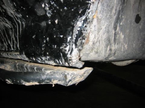 1995 Ford Bronco - Undercarriage view of a vehicle, focusing on the frame and lower body panels.