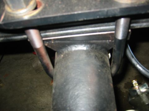 1995 Ford Bronco - Detail of a vehicle's suspension system, showing mechanical components and hardware.