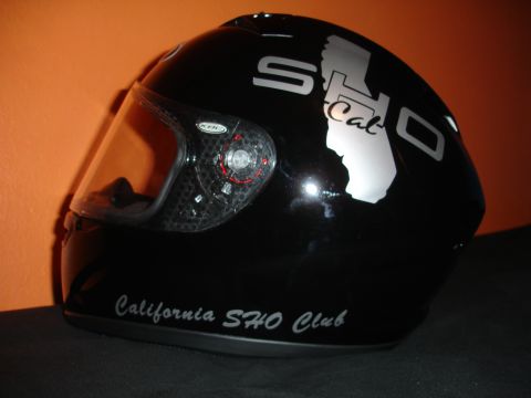 1993 Ford Taurus - A black motorcycle helmet features graphics related to the California SHO Club.