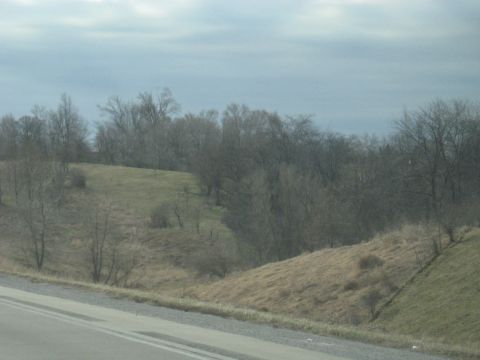 1978 Ford Bronco - A view of a rural landscape under an overcast sky, showing hills and trees.