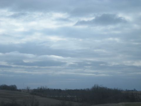 1978 Ford Bronco - A wide view of a cloudy sky over a desolate winter landscape.