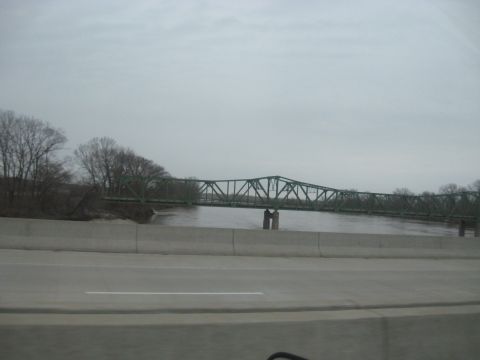 1978 Ford Bronco - A view of a bridge crossing a river on an overcast day.
