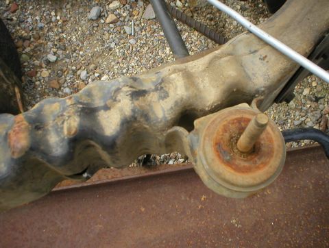 1996 Ford Bronco - This is a close-up view of a rusty suspension part, likely from an older vehicle.