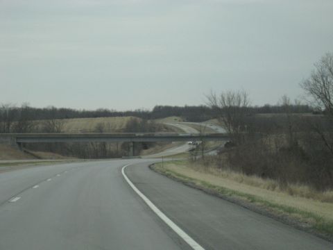 1978 Ford Bronco - A highway scene with an overpass and a road curving into the distance.