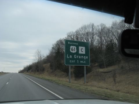 1978 Ford Bronco - Roadside sign directs travelers to Business 61 C and La Grange, with the exit one mile ahead.