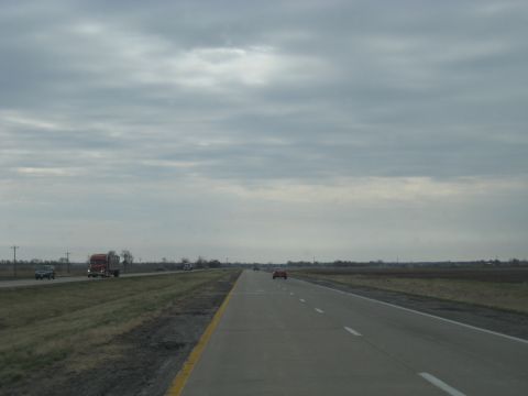 1978 Ford Bronco - Vehicles travel along a highway on an overcast day.