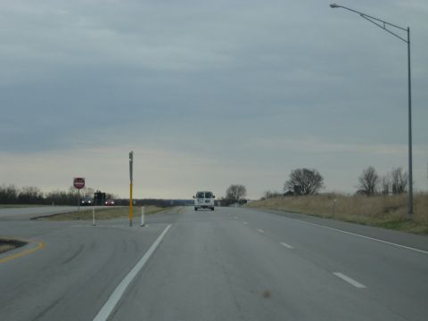 1978 Ford Bronco - A white van travels down a highway, with other vehicles visible in the distance.