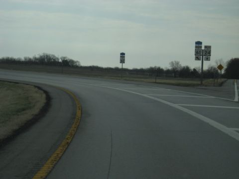 1978 Ford Bronco - Road signs indicate an intersection for routes 61 and 24 under an overcast sky.