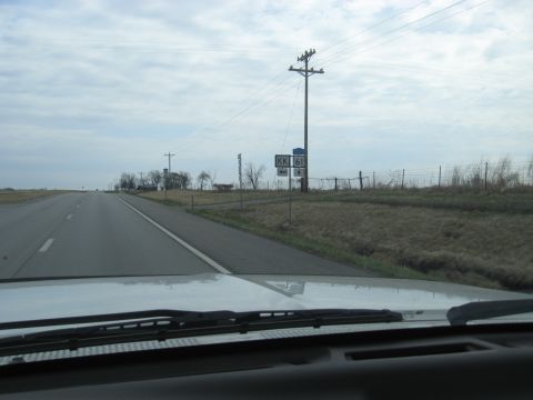 1978 Ford Bronco - View from inside a vehicle shows a highway scene with directional signs for KK 61.