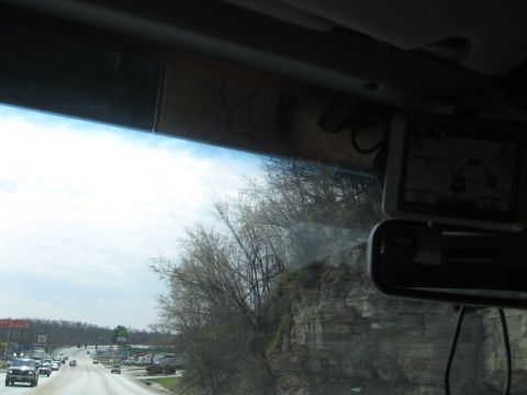 1978 Ford Bronco - View from inside a vehicle traveling on a highway, with a GPS device mounted on the windshield.