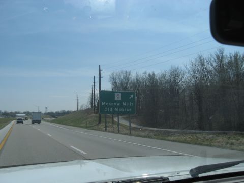 1978 Ford Bronco - A green highway sign indicates directions to Moscow Mills and Old Monroe.