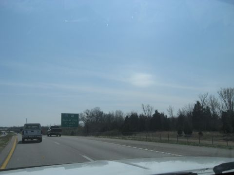 1978 Ford Bronco - Driving on the highway with two trucks ahead and a sign for Kansas City and St. Louis.