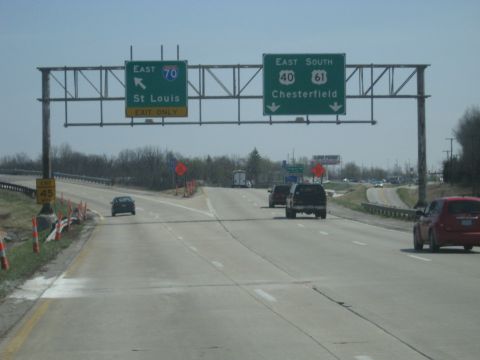 1978 Ford Bronco - Driving on the highway with directional signs and other vehicles present.