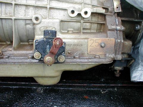 1996 Ford Bronco - This image shows a close-up of a Ford transmission, likely a component of a vehicle, with visible part numbers and markings.