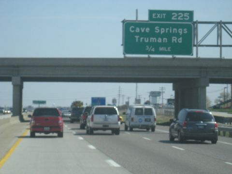 1978 Ford Bronco - Traffic moves along the highway under an overpass, with multiple vehicles visible in different lanes.