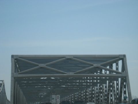 1978 Ford Bronco - View from a vehicle traveling across a large bridge, with other cars and trucks visible on the roadway below.