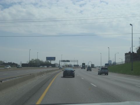 1978 Ford Bronco - Driving on a highway with traffic and the St. Louis Gateway Arch in the distance.
