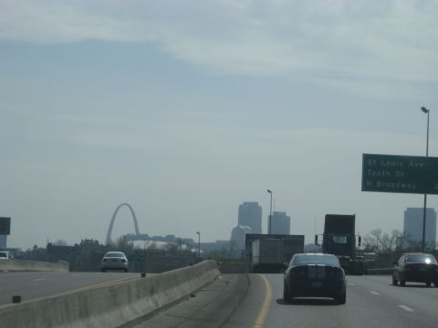 1978 Ford Bronco - Highway view of St. Louis with the Gateway Arch and city buildings in the distance.