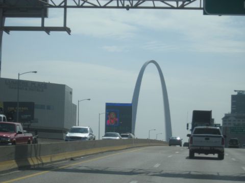 1978 Ford Bronco - Driving past the Gateway Arch in St. Louis with traffic on the highway.
