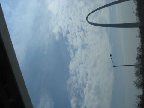 1978 Ford Bronco - The Gateway Arch is visible against a sky filled with clouds.