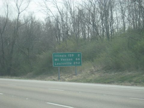 1978 Ford Bronco - A green highway sign indicates distances to Illinois, Mt Vernon, and Louisville.