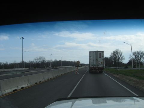 1978 Ford Bronco - Driving on a highway with a semi-trailer truck in front, under a cloudy sky.