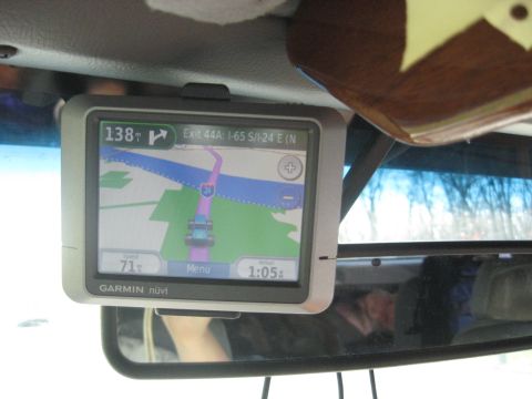 1978 Ford Bronco - A Garmin nuvi GPS device is mounted to the windshield, displaying a navigation route and current speed.