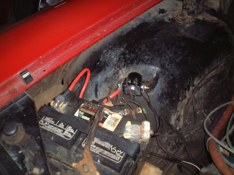 1967 Ford Galaxie - Dual batteries and starter solenoid installation in a vehicle's engine compartment.