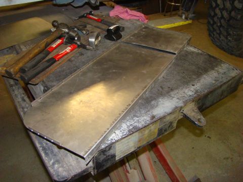 1948 Jeep Wrangler - Sheet metal panel and bodywork tools laid out on a workbench, ready for fabrication.