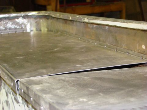 1948 Jeep Wrangler - Sheet metal panels are riveted together, showing a section of custom fabrication work.